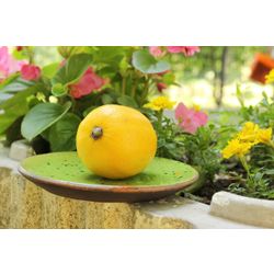 Handmade ceramic saucer made of high-temperature fired clay.