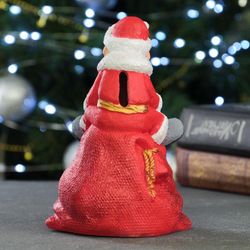 Хорошие сувениры / Piggy bank "Santa Claus on a bag"