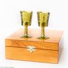 A set of zirconia glasses on the leg in a wooden gift box