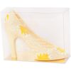 Sculpture of white chocolate "Shoe" with a yellow-white ornament