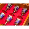 A set of zirconia glasses on the leg in a wooden gift box