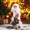 Зимнее волшебство / Doll "Santa Claus, in a red and white fur coat in a cage with gifts"