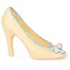 Sculpture of white chocolate "Shoe" with marzipan bead