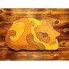 Wooden toy puzzle of the "Sleeping cat"