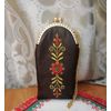 A watchman on a chain of natural leather with gold embroidery