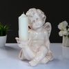 Хорошие сувениры / Candlestick "Angel sitting in the hand" 26x21x30 cm