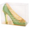 Sculpture of white chocolate "Shoe" with a yellow ornament
