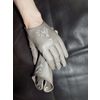 Natural leather gloves are grey with handmade gold embroidery